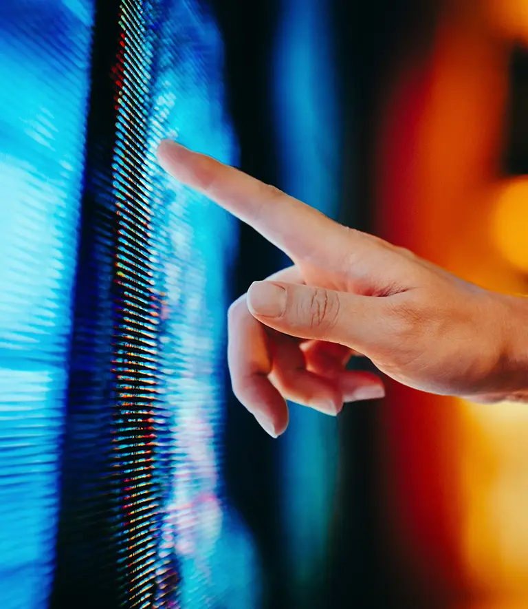 Finger pointing at data on a computer screen.